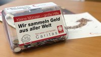 Sammeldose der Caritas für D-Mark, Euro und Fremdwährungen